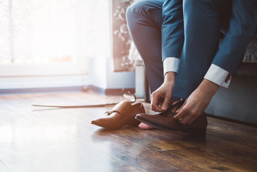 groom dressing up with classic elegant shoes.