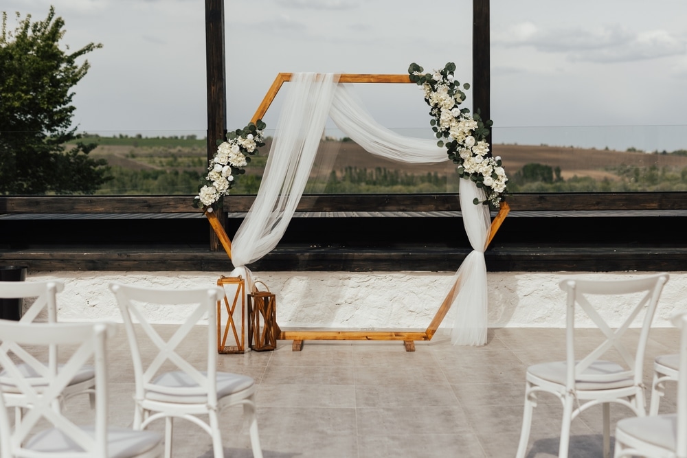 Wedding Wooden Arch In Rustic Style Decorated With White Flowers