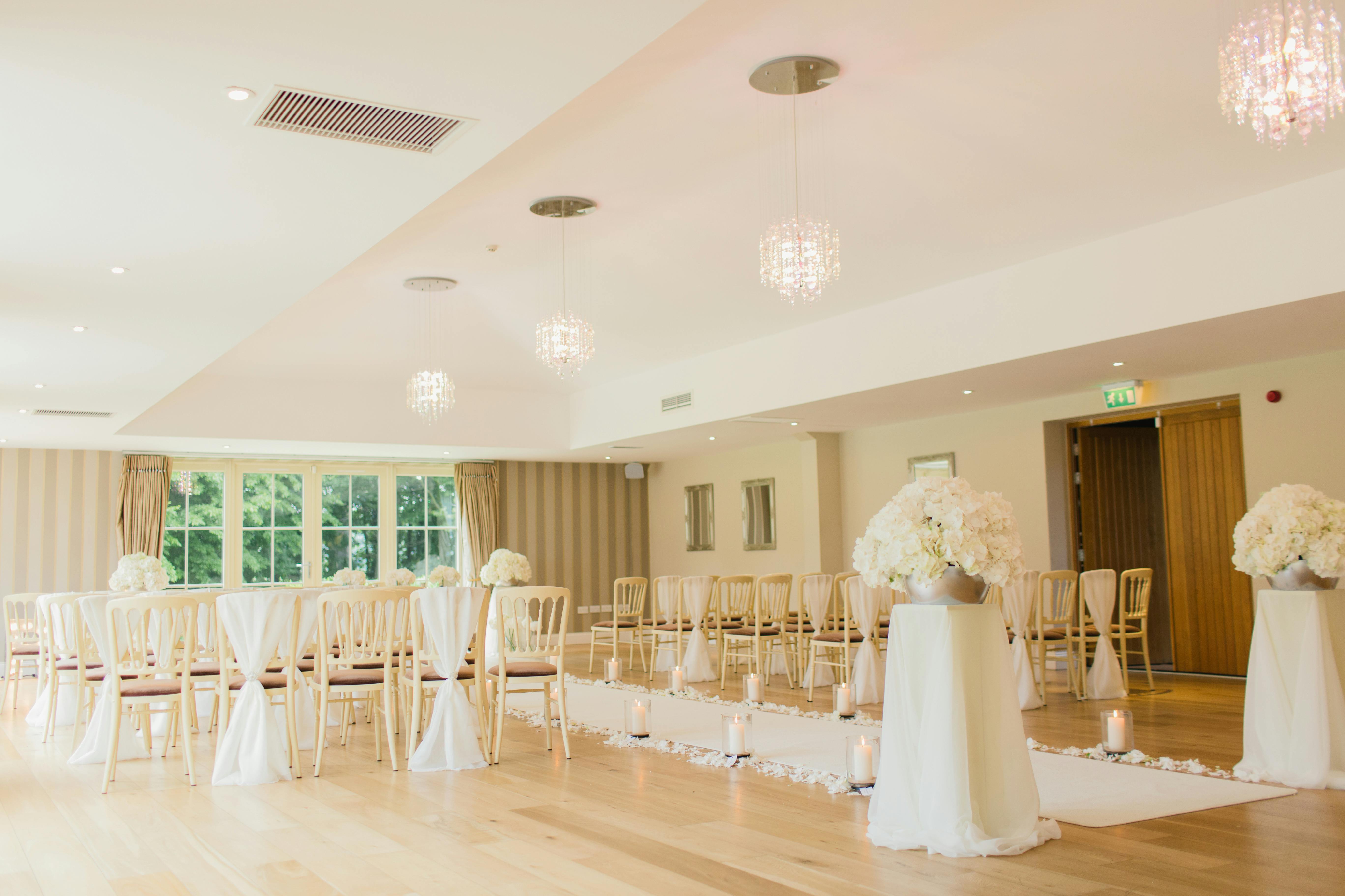 candles on the side of wedding aisle