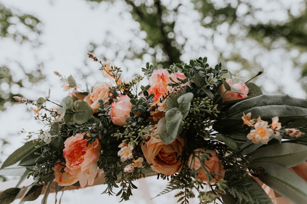 Looking Up Into A Canopy Of Wedding Florals