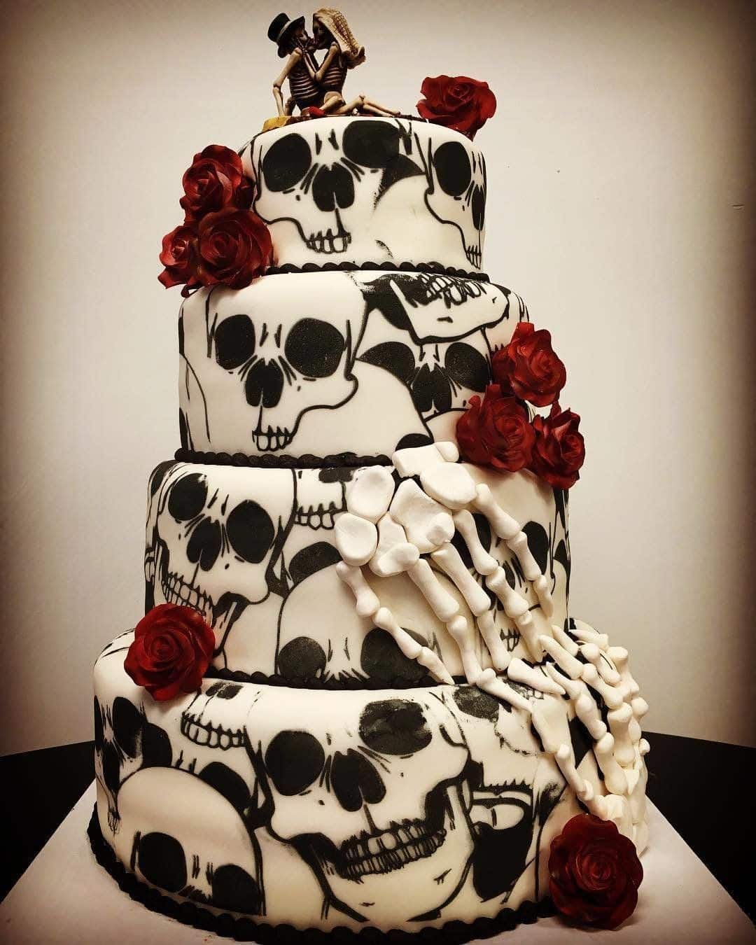 halloween themed cake with skulls on it