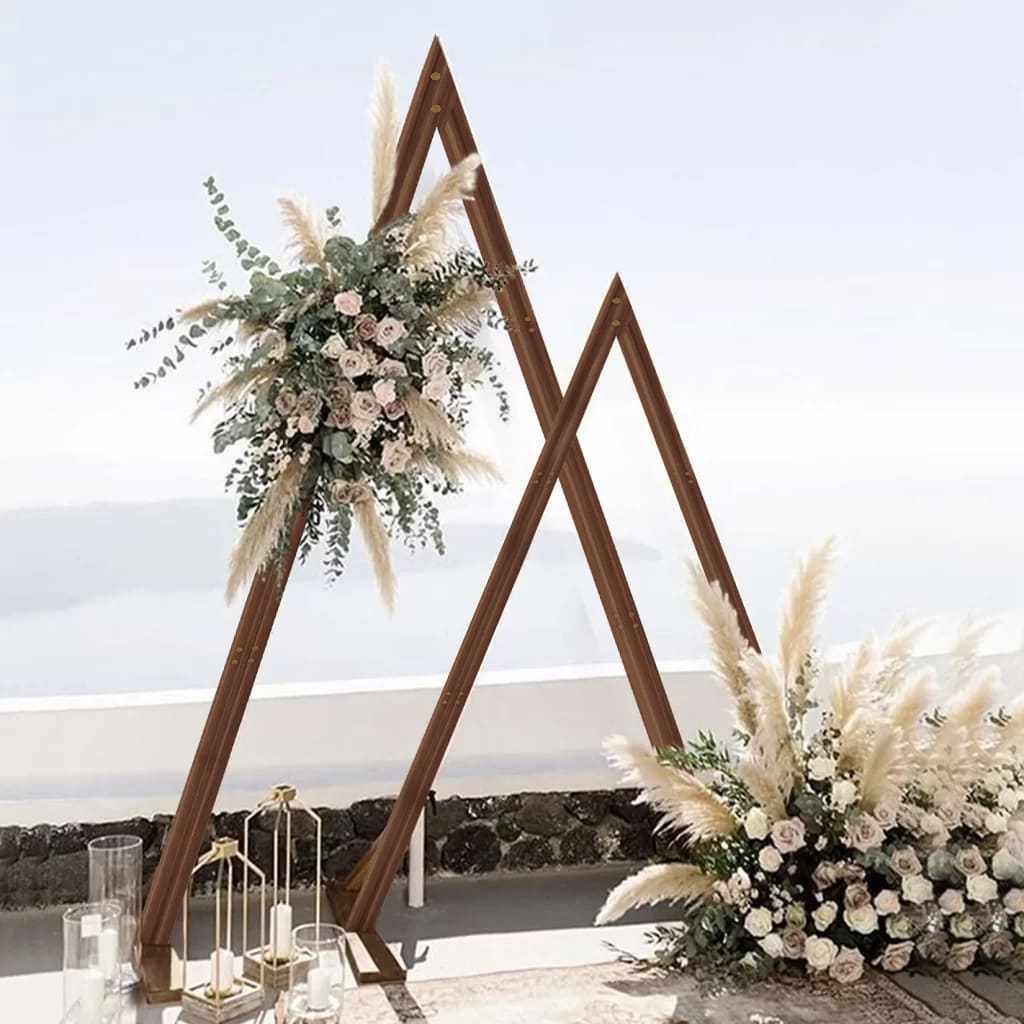 wooden arch with geometric designs decorated with flowers