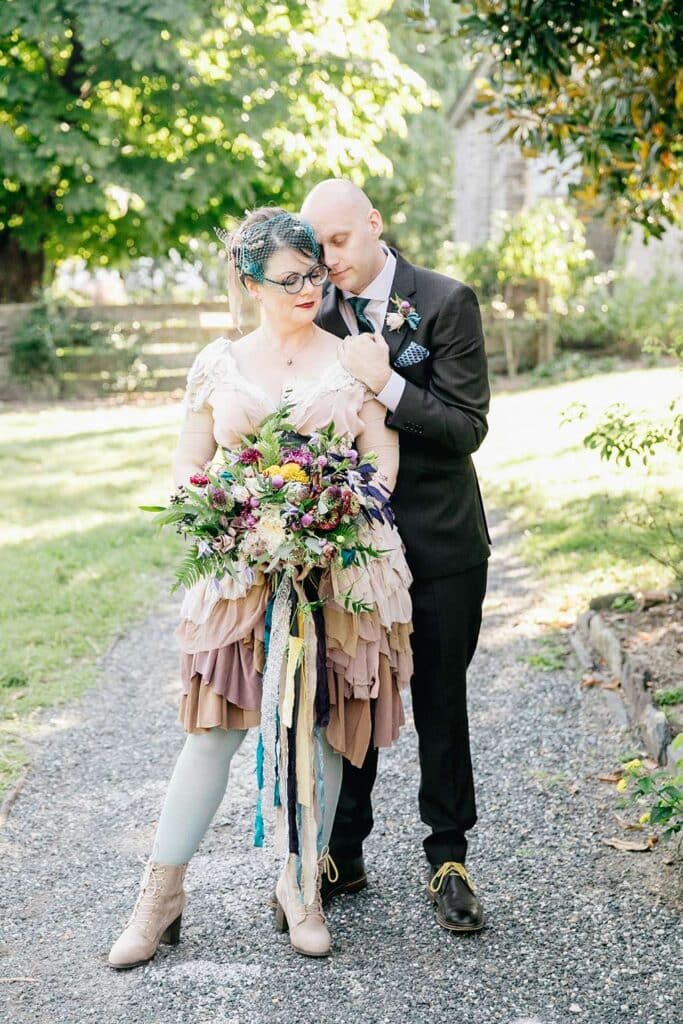 A view of a bride and groom at a quacker wedding posing