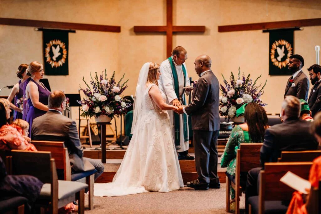 A view of a couple taking vows at a lutheran wedding