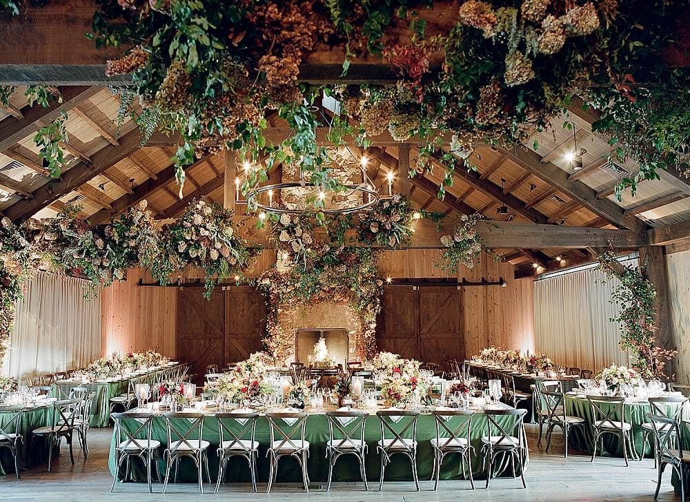 A view of a wedding arrangement with flowers decor and seating arrangement