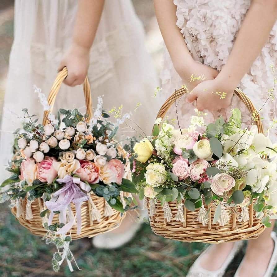 A view of girls holding floral baskets