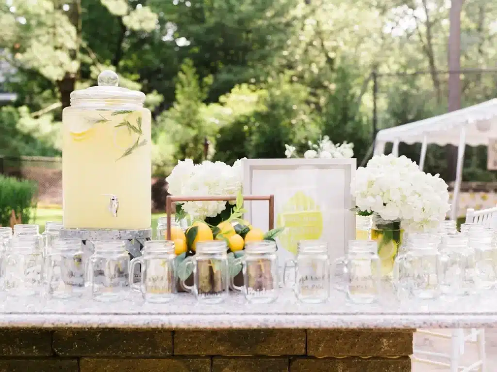 A wedding decor with beverage station and flowers