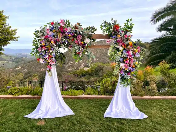 A wedding flower arch outdoors