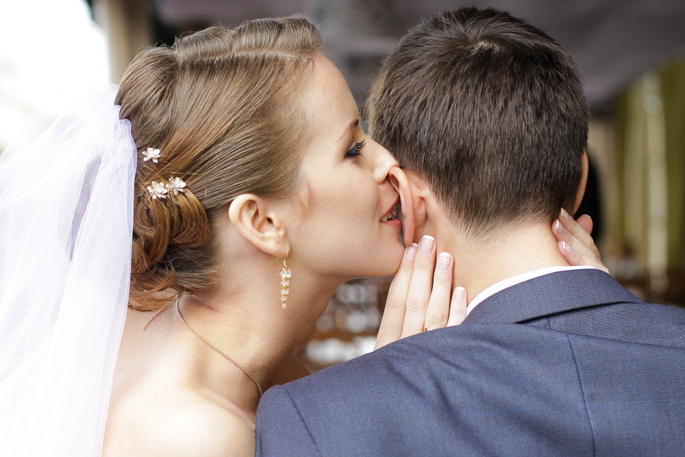 Bride Is Whispering I Love You Into His Groom Ear