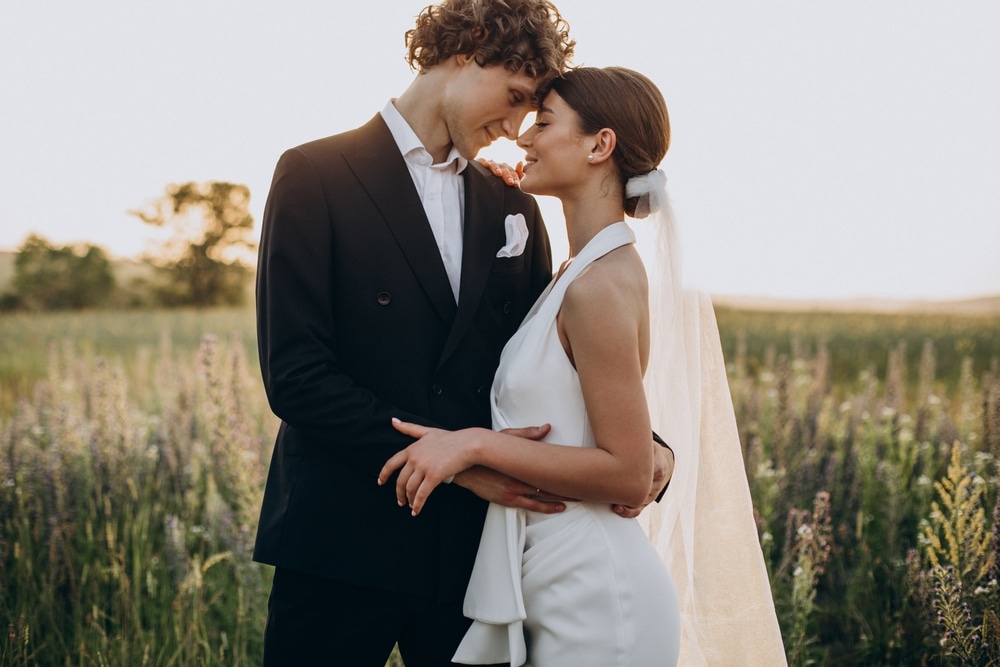 Young Wedding Couple Together In Field