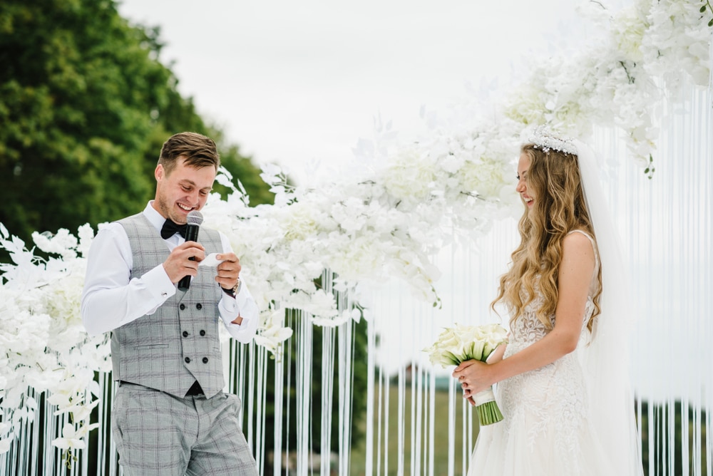 A view of a bride and groom exchanging wedding vows