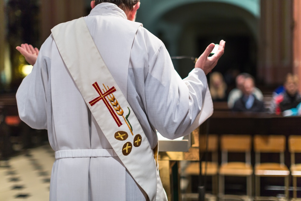 A view of a priest at a wedding ceremony