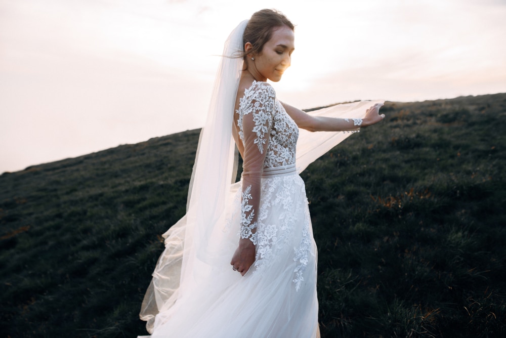 Beautiful Bride In Lace Wedding Dress And The Long Veil