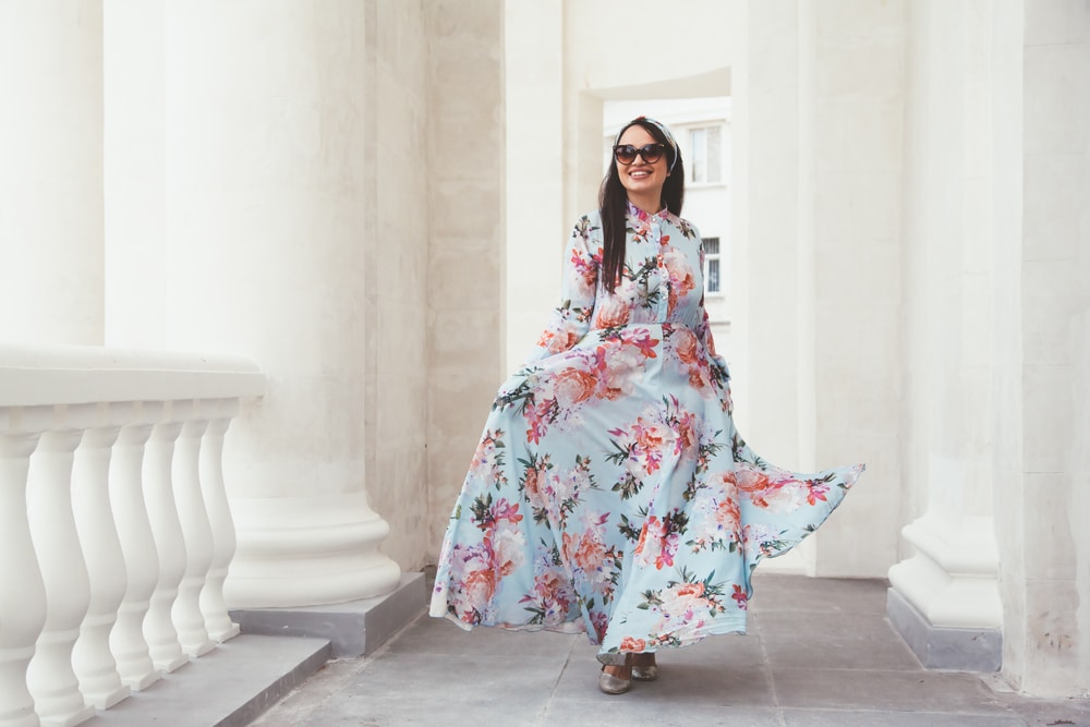 Plus Size Model Wearing Floral Maxi Dress Posing On The