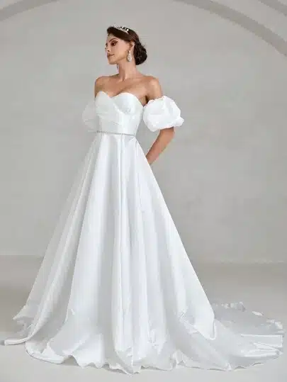 a bride wearing off shoulder white color wedding gown