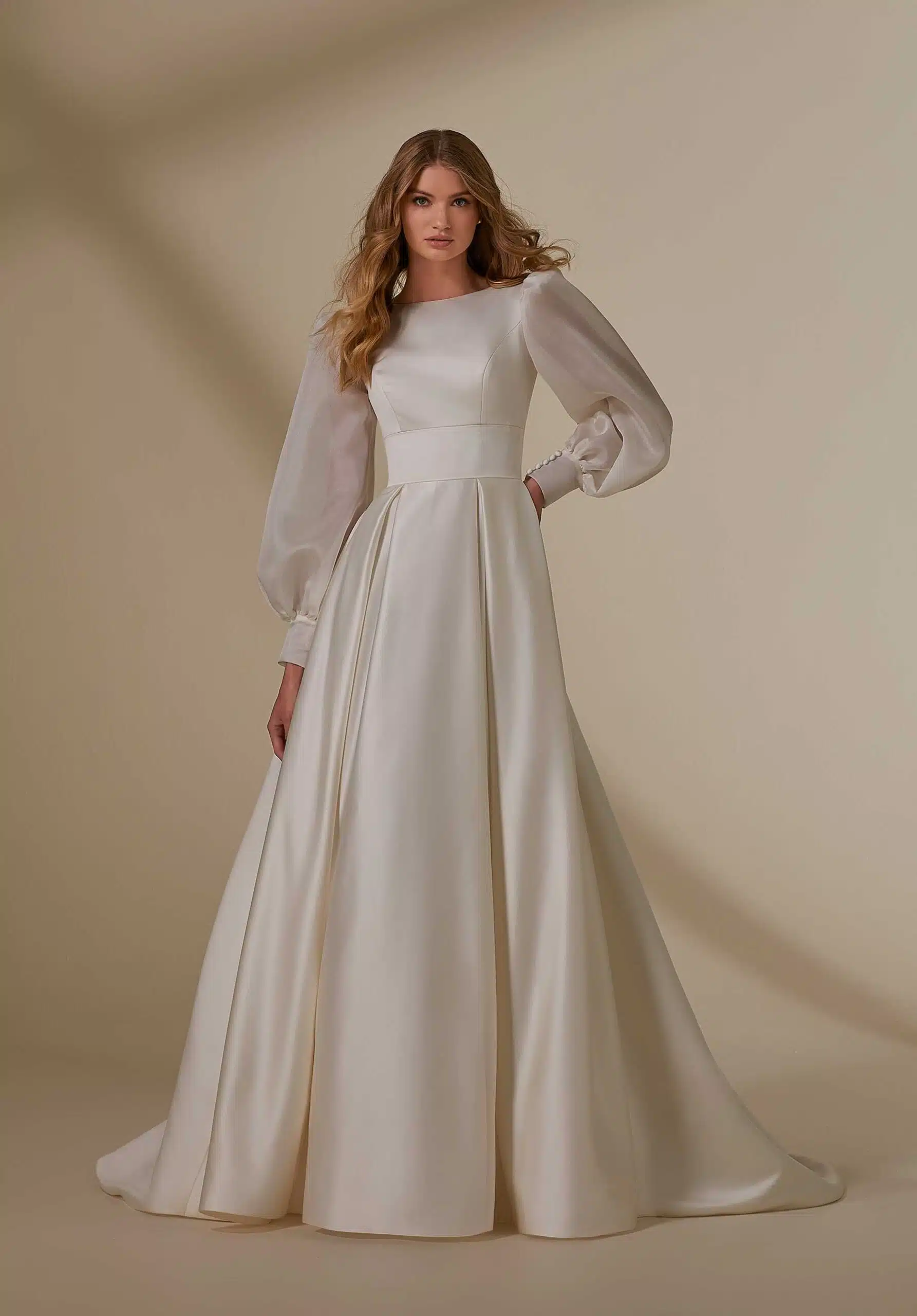 a female wearing long satin silk white color dress with open hair