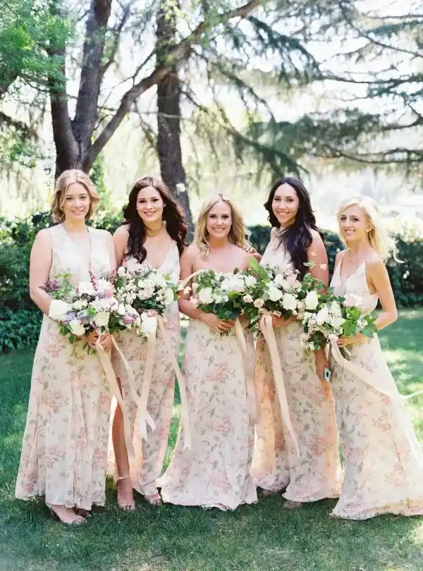 bride and bridesmaid holding flower bouqut