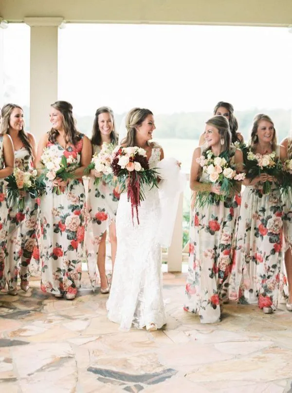 bride wearing white and bridemaids wearing fawn color floral dresses