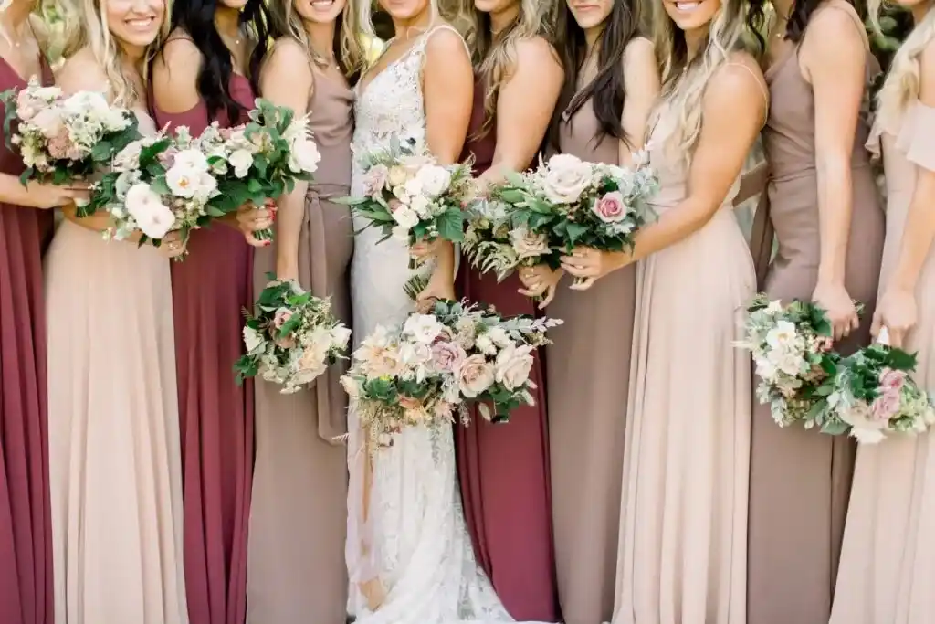 bridemaids holding flower bouquet 