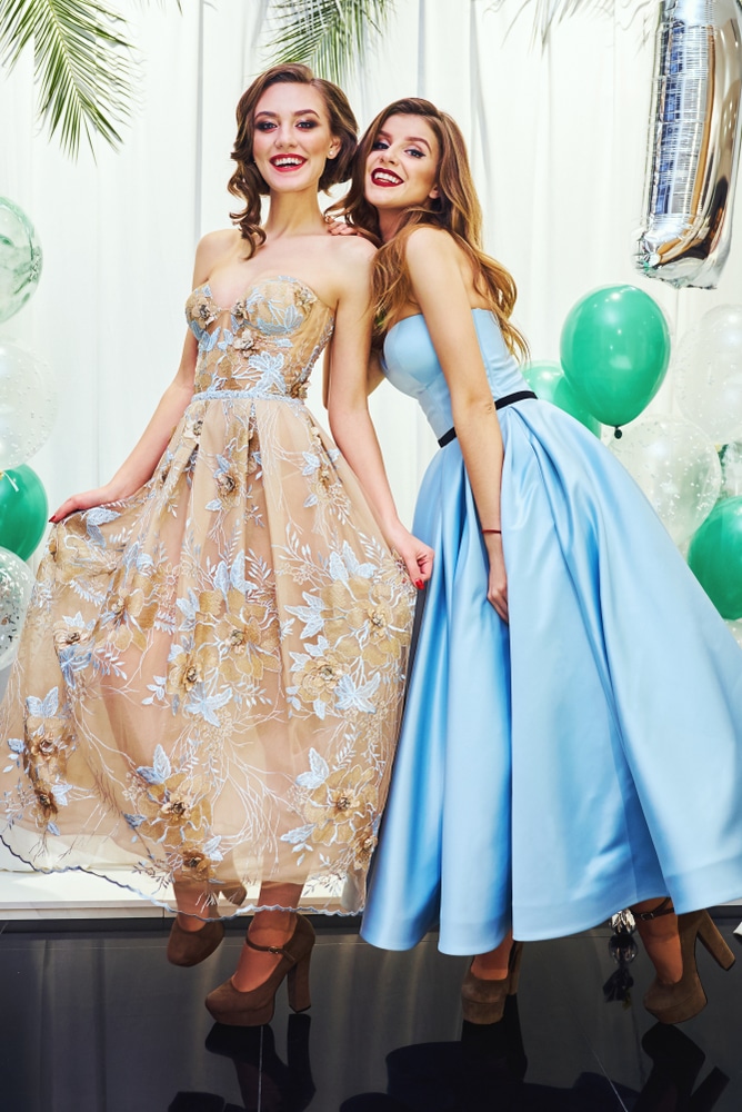 Two Beautiful Young Women Shopping In A Clothes Shop