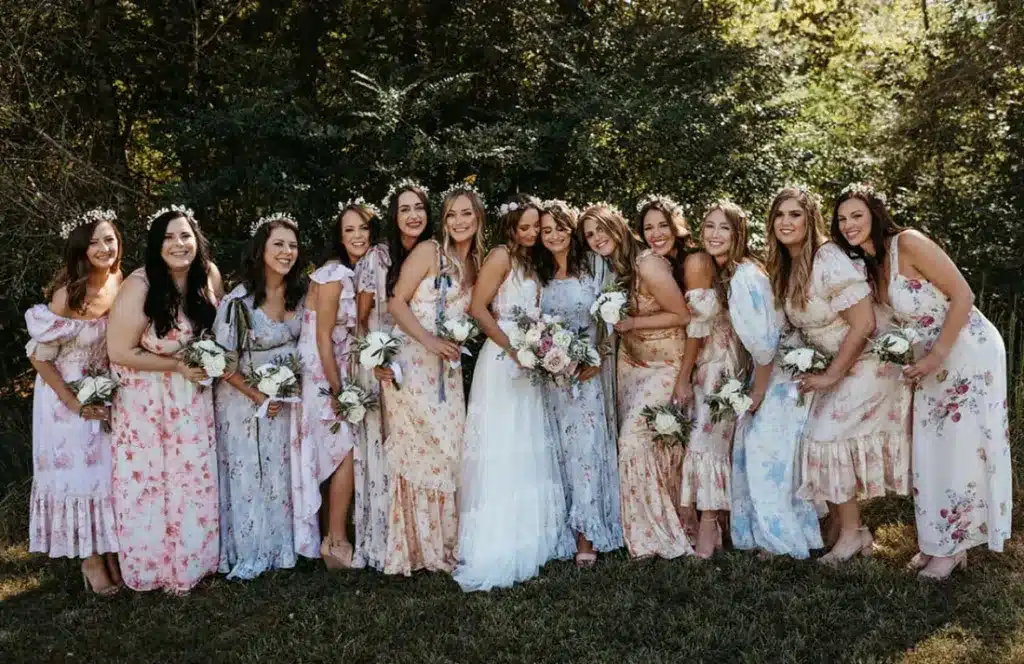 bride and bridemaids wearing pink and blue floral dresses