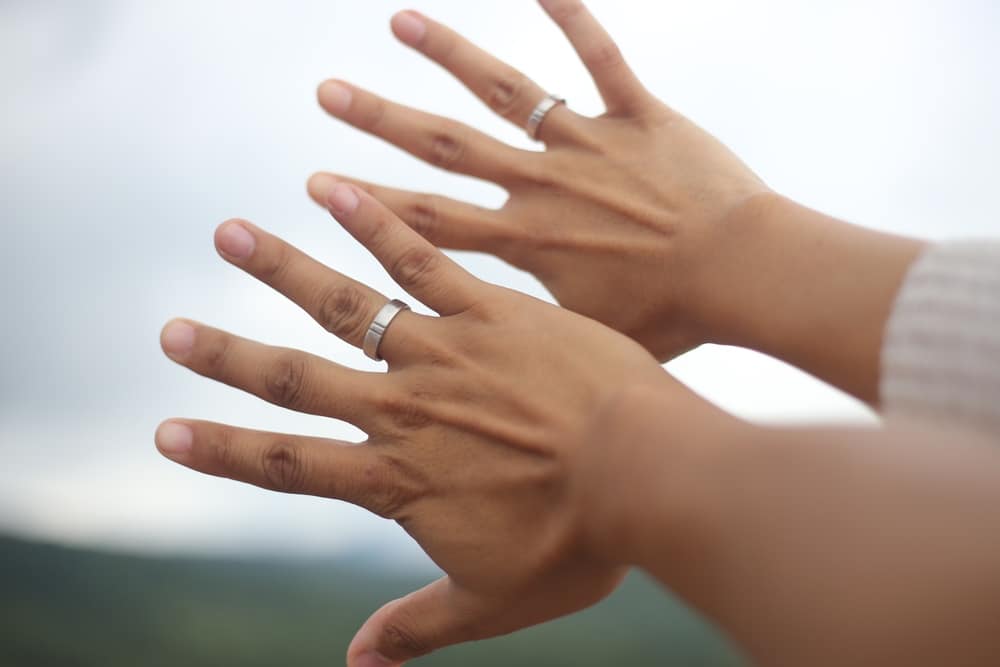 Silver Rings On The Hand Of A Man And A women 