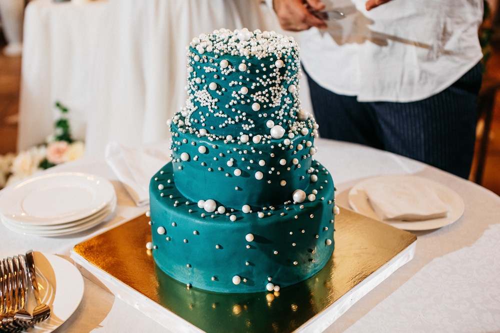 Hunter green wedding cake adorned with pearls